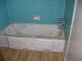 Porcelain tub and tile walls (before)