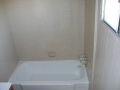 Porcelain tub & Tile walls (after. Tub done in high gloss white, walls in speckle finish 12-ACRT)